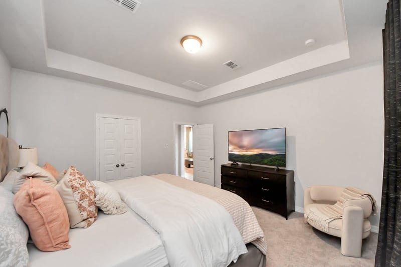 Staged bedroom in Cypress, TX by Halo Staging & Design