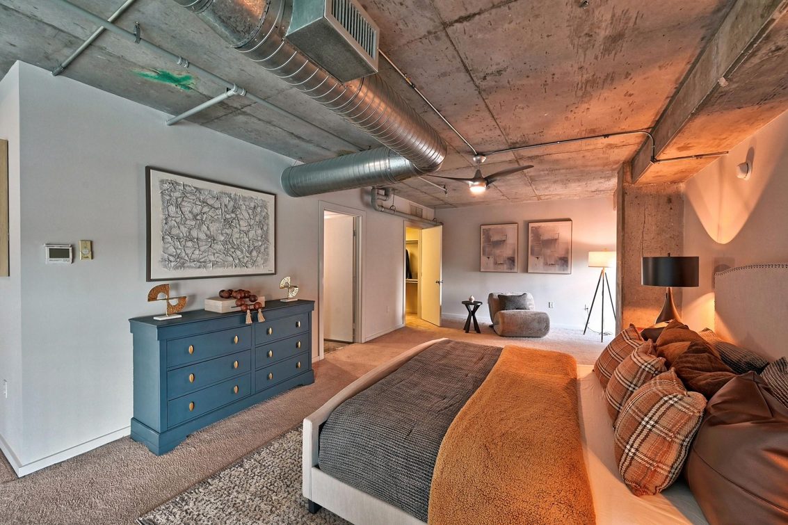 Staged loft bedroom in Houston, TX by Halo Staging & Design